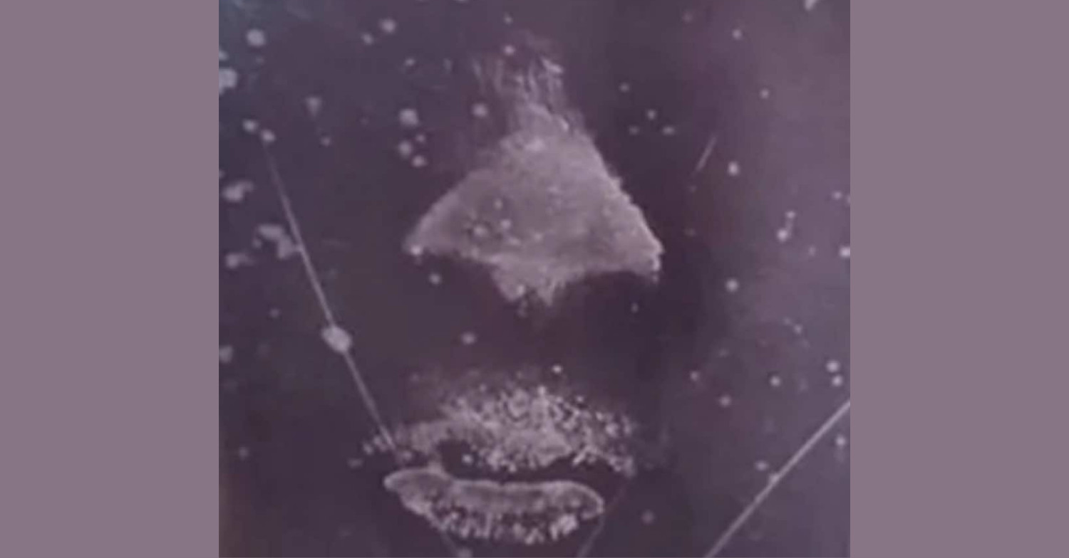 Kiss on window from Jillian that was lifted like a fingerprint by the forensics department. The imprint clearly displays her nose and lips on a black background.